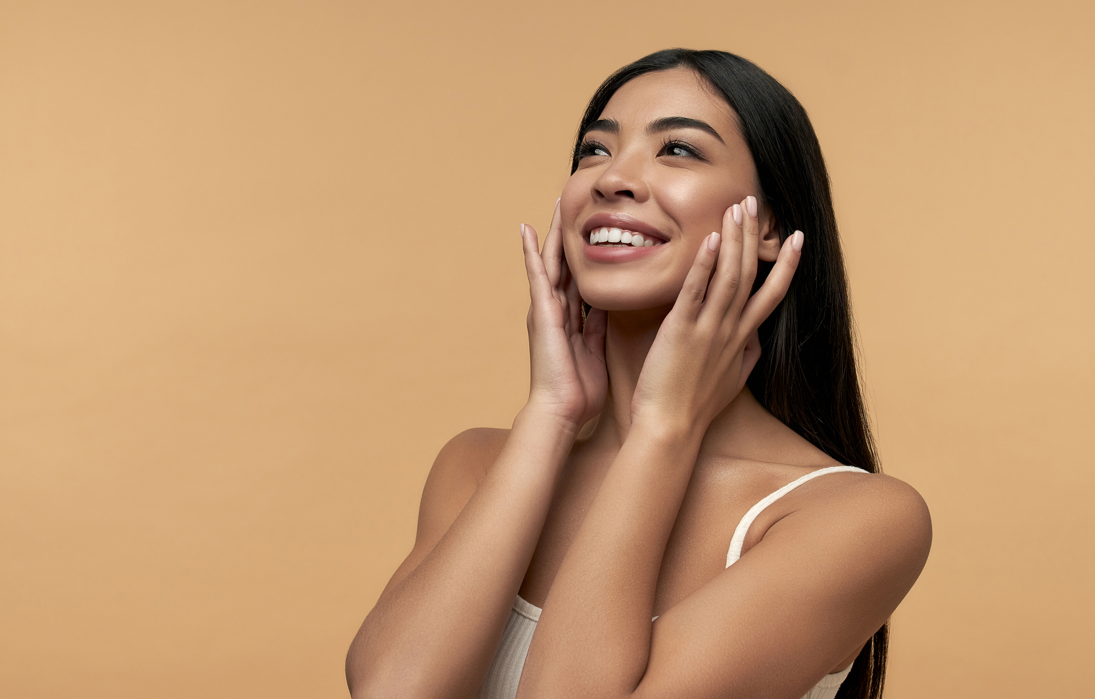 Woman enjoying glowing skin after LED light therapy