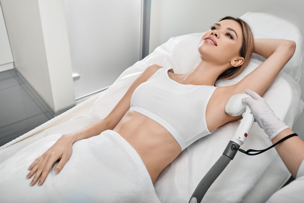 Woman undergoing laser hair removal for the armpits